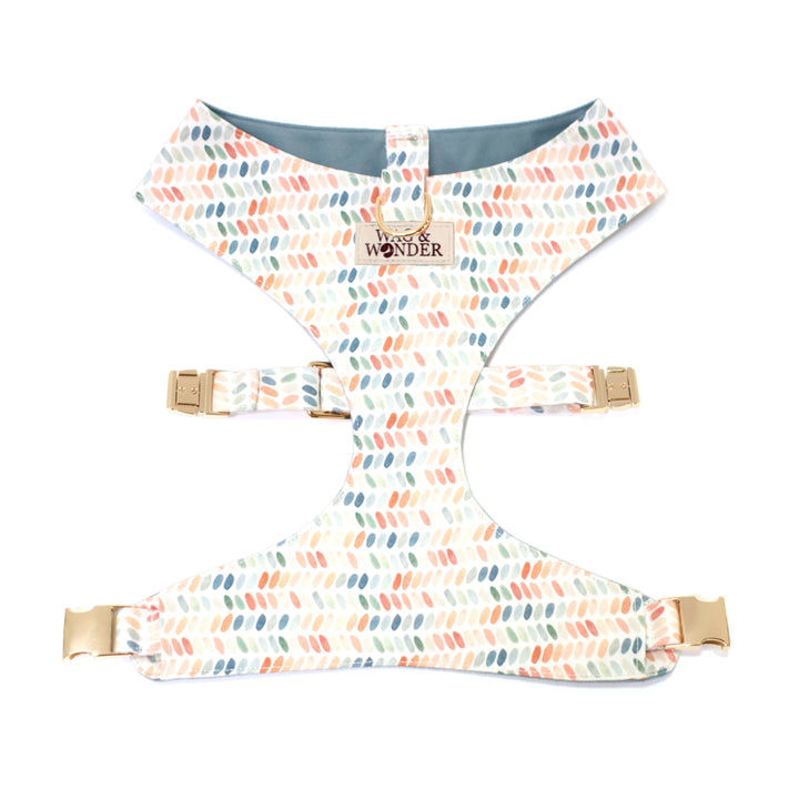 Reversible dog harness in modern polka dot print and gold hardware.