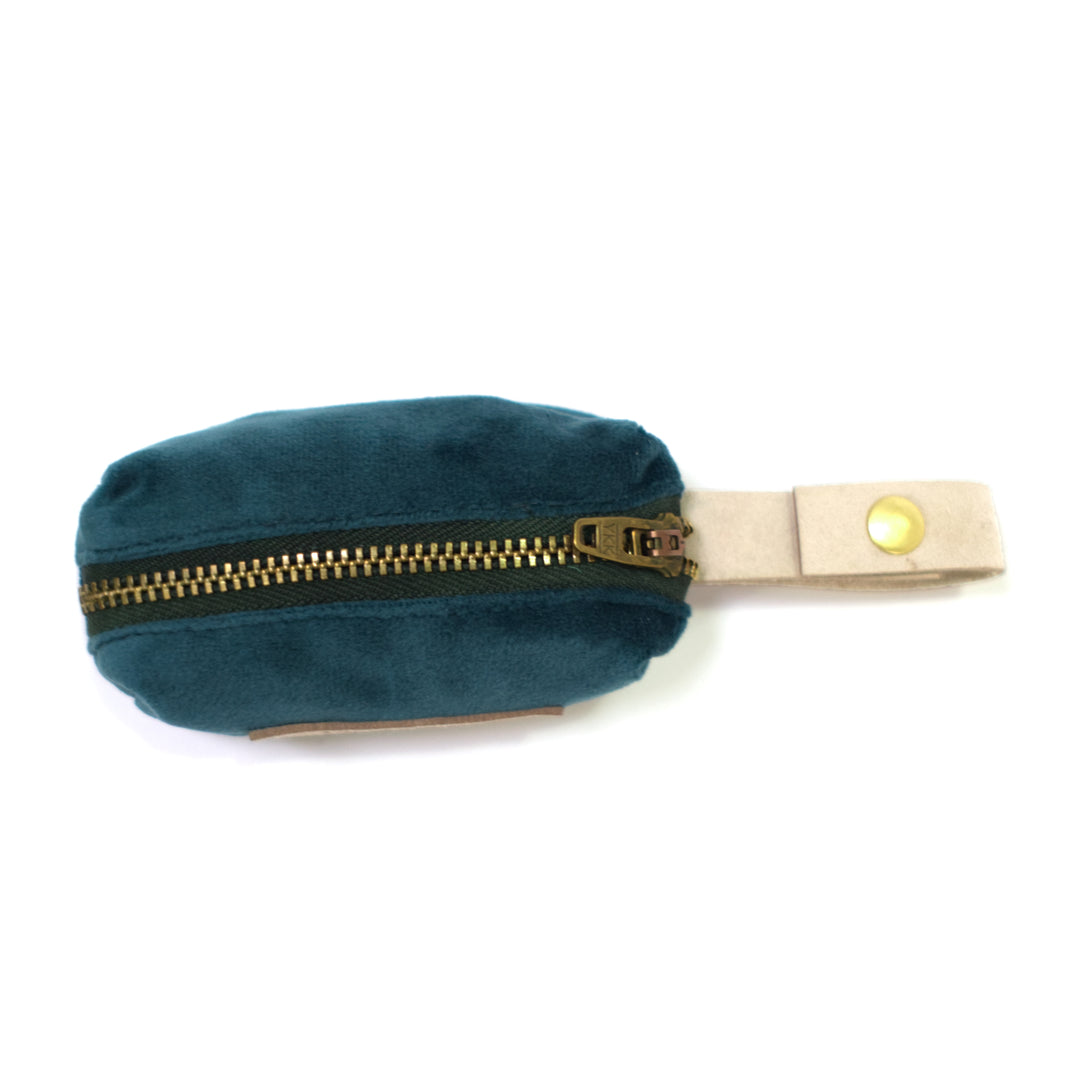 Dark teal dog poop bag holder shown from top